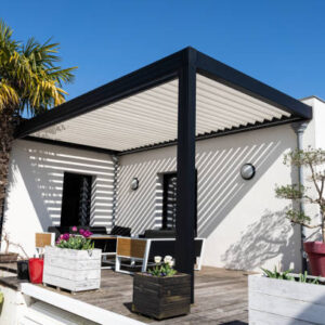 eco friendly bioclimatic aluminum pergola shade structure, awning and patio roof, garden lounge, chairs, metal grill surrounded by landscaping